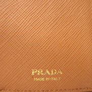 Prada Saffiano Leather Trifold Wallet Enamel Triangle Logo Natural Brown available at Queen Bee of Beverly Hills