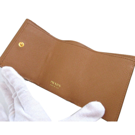 Prada Saffiano Leather Trifold Wallet Enamel Triangle Logo Natural Brown available at Queen Bee of Beverly Hills