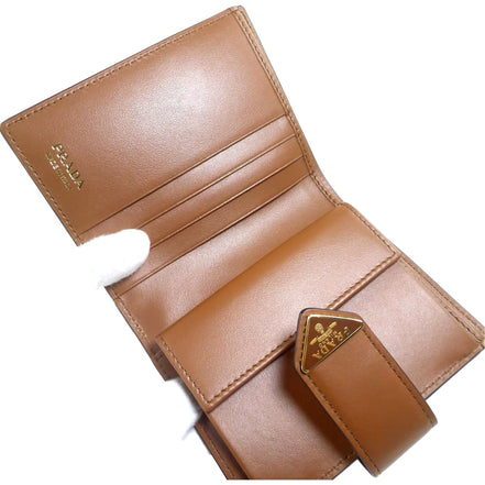 Prada City Calf Leather Snap Bifold Wallet Cognac Brown available at Queen Bee of Beverly Hills
