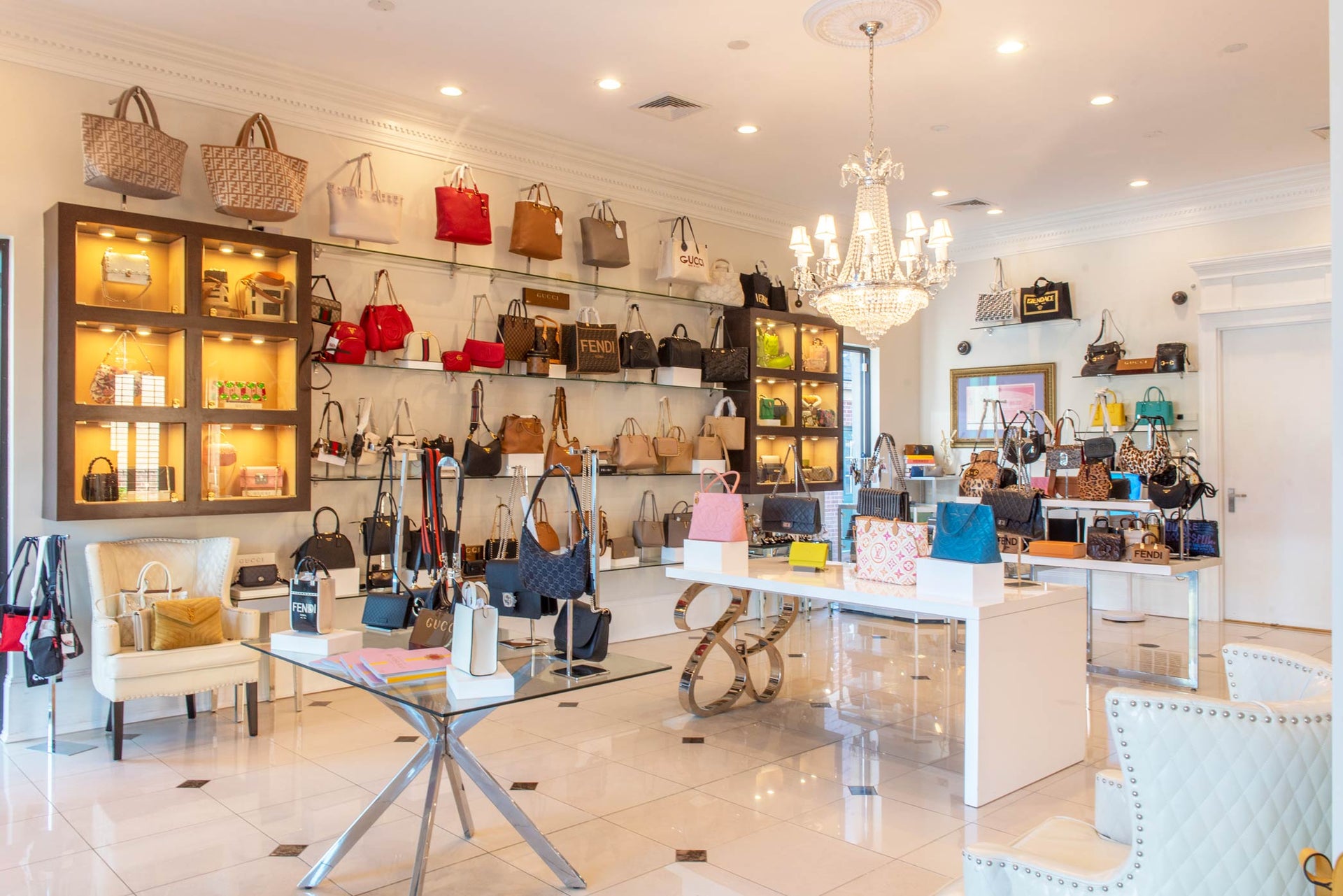 Interior of Queen Bee of Beverly Hills Designer Handbag Retail Store. Shop in-store in Huntsville, Alabama.