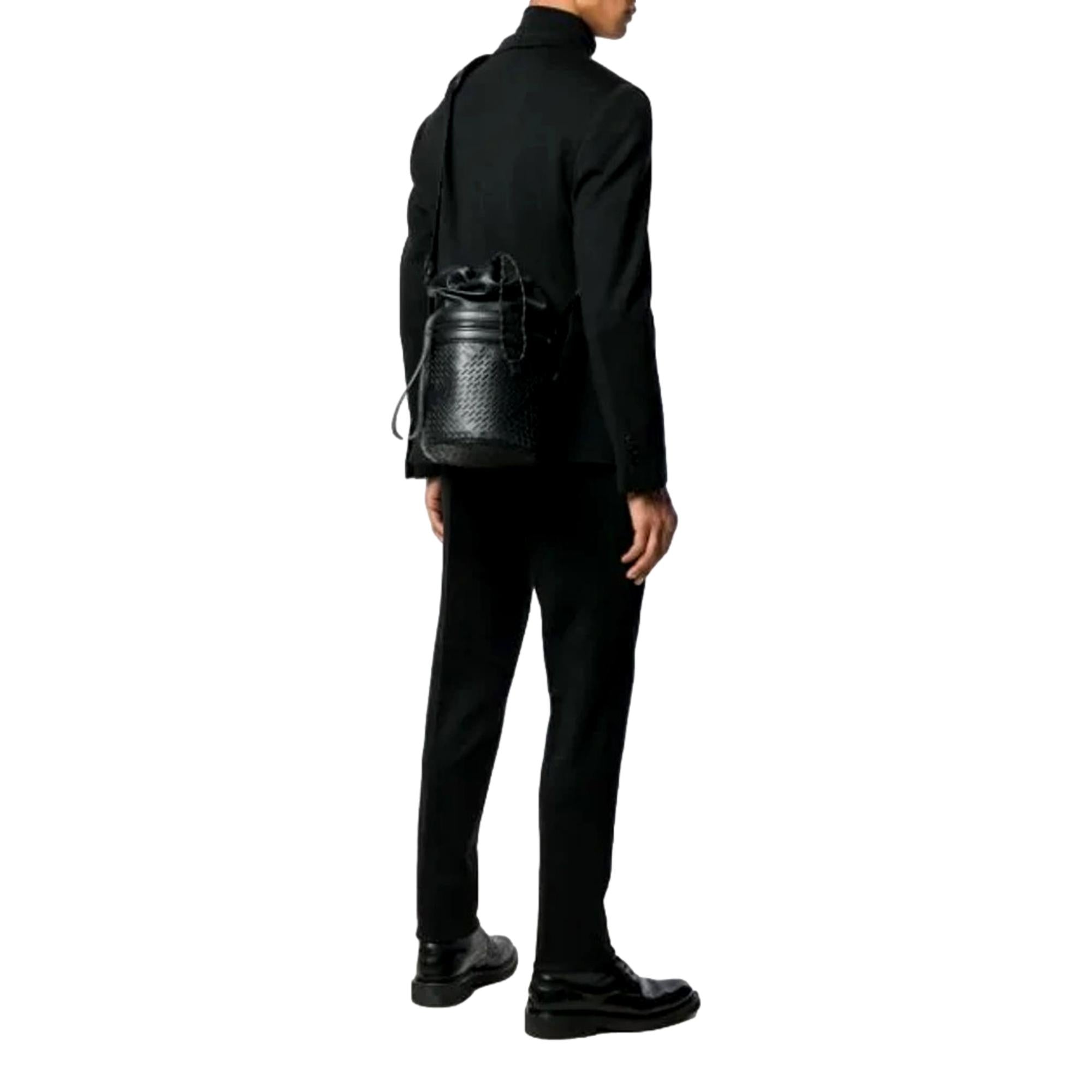 Bottega Veneta Perforated Black Leather Drawstring Bucket Crossbody Bag available at Queen Bee of Beverly Hills