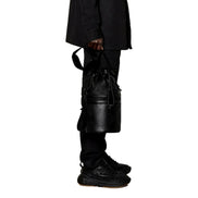 Bottega Veneta Perforated Black Leather Drawstring Bucket Crossbody Bag available at Queen Bee of Beverly Hills