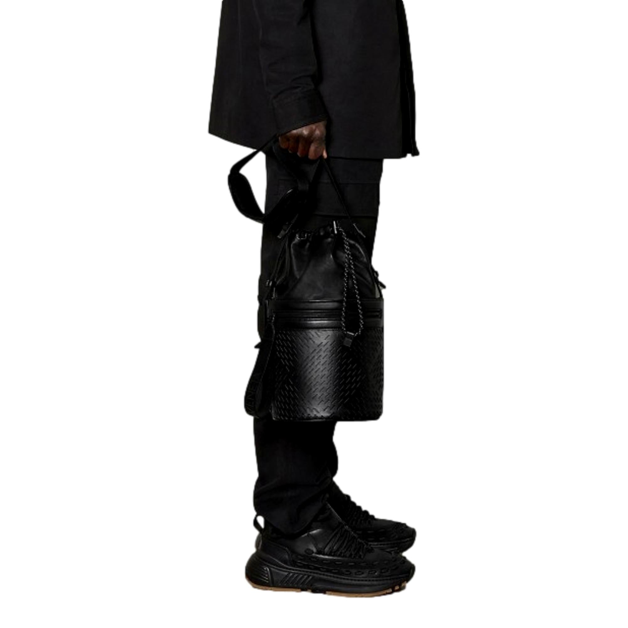 Bottega Veneta Perforated Black Leather Drawstring Bucket Crossbody Bag available at Queen Bee of Beverly Hills