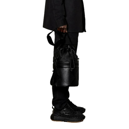 Bottega Veneta Perforated Black Leather Drawstring Bucket Crossbody Bag available at Queen Bee of Beverly Hills