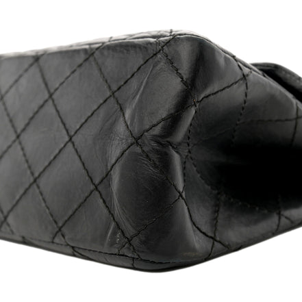 Chanel Black Aged Calfskin Quilted 2.55 Reissue 225 Flap Handbag With Chain available at Queen Bee of Beverly Hills