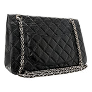 Chanel Black Aged Calfskin Quilted 2.55 Reissue 225 Flap Handbag With Chain available at Queen Bee of Beverly Hills