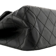 Chanel Black Aged Calfskin Quilted 2.55 Reissue 225 Flap Handbag With Chain available at Queen Bee of Beverly Hills