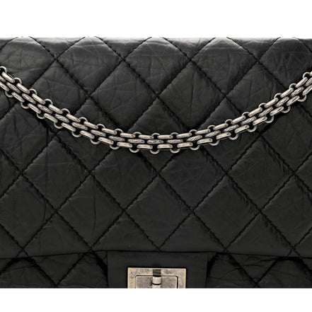 Chanel Black Aged Calfskin Quilted 2.55 Reissue 225 Flap Handbag With Chain available at Queen Bee of Beverly Hills