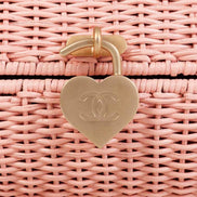 Chanel Pink Oval Wicker Heart CC Charm Closure 2-Way Handle Crossbody Bag available at Queen Bee of Beverly Hills