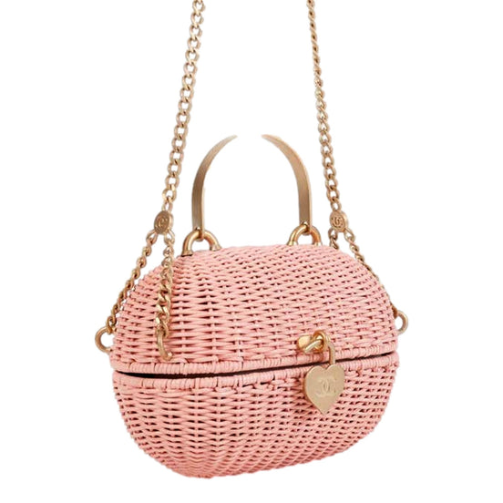 Chanel Pink Oval Wicker Heart CC Charm Closure 2-Way Handle Crossbody Bag available at Queen Bee of Beverly Hills