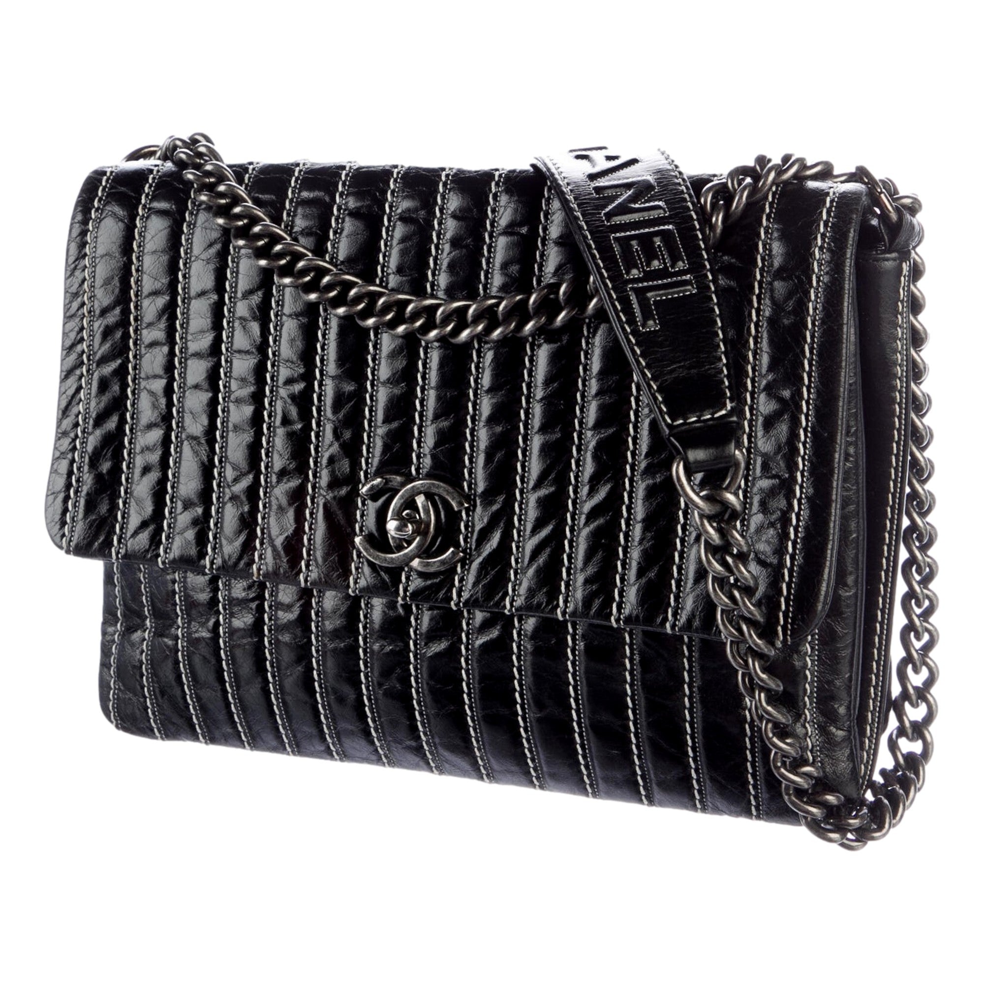Chanel White Vertical Stitch Black Flap Bag available at Queen Bee of Beverly Hills