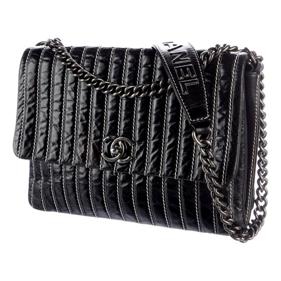 Chanel White Vertical Stitch Black Flap Bag available at Queen Bee of Beverly Hills