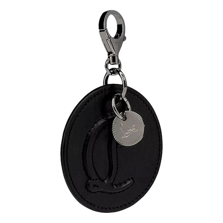 Christian Louboutin Round Leather Logo Black Bag Charm Keychain available at Queen Bee of Beverly Hills