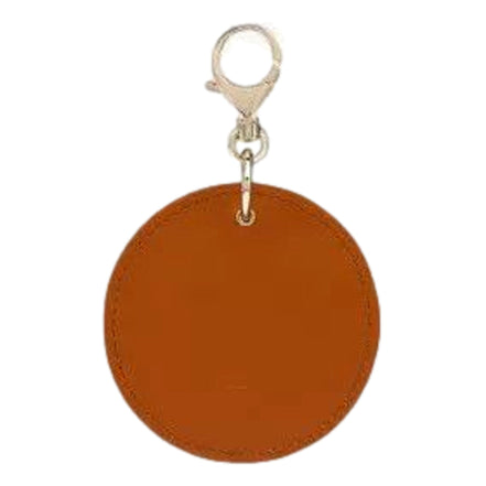 Christian Louboutin Round Leather Logo Brown Bag Charm Keychain available at Queen Bee of Beverly Hills