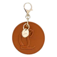 Christian Louboutin Round Leather Logo Brown Bag Charm Keychain available at Queen Bee of Beverly Hills