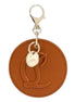 Christian Louboutin Round Leather Logo Brown Bag Charm Keychain available at Queen Bee of Beverly Hills
