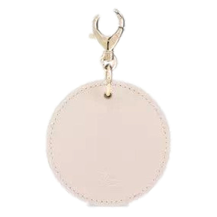 Christian Louboutin Round Leather Logo Leche Cream Bag Charm Keychain available at Queen Bee of Beverly Hills