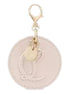 Christian Louboutin Round Leather Logo Leche Cream Bag Charm Keychain available at Queen Bee of Beverly Hills
