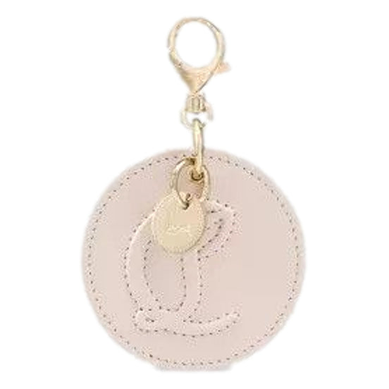 Christian Louboutin Round Leather Logo Leche Cream Bag Charm Keychain available at Queen Bee of Beverly Hills
