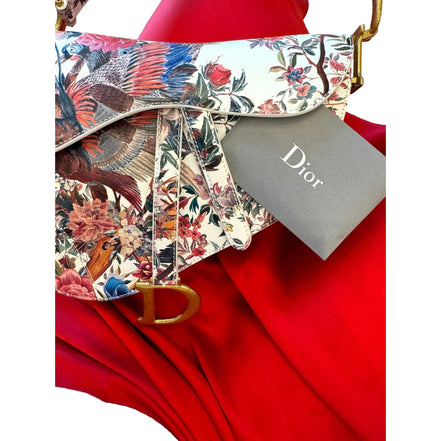 Dior Saddle Floral Bird Print Leather Crossbody Bag with Gold Charm - available at Queen Bee of Beverly Hills.