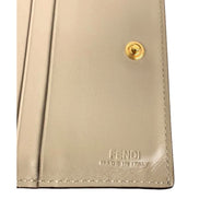 Fendi F is Fendi Tortora Gray Leather Bifold Wallet available at Queen Bee of Beverly Hills