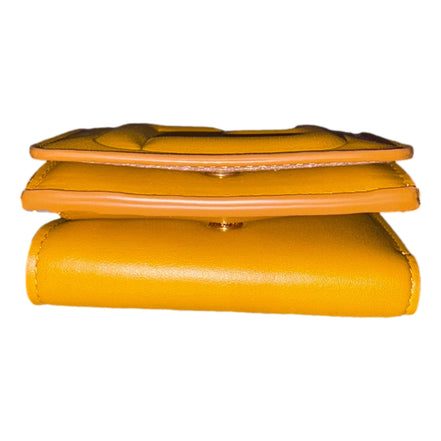 Fendi FF Cube Embossed Logo Oro Yellow Leather Trifold available at Queen Bee of Beverly Hills