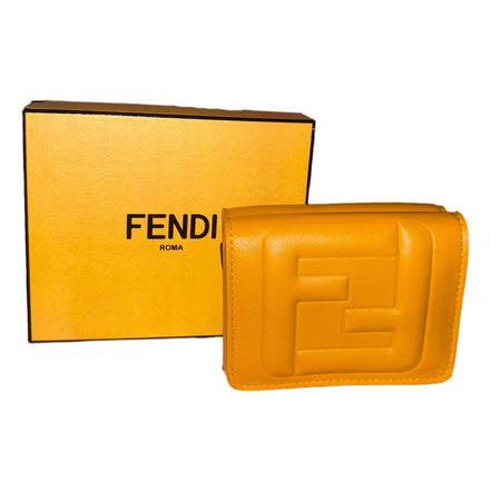 Fendi FF Cube Embossed Logo Oro Yellow Leather Trifold available at Queen Bee of Beverly Hills