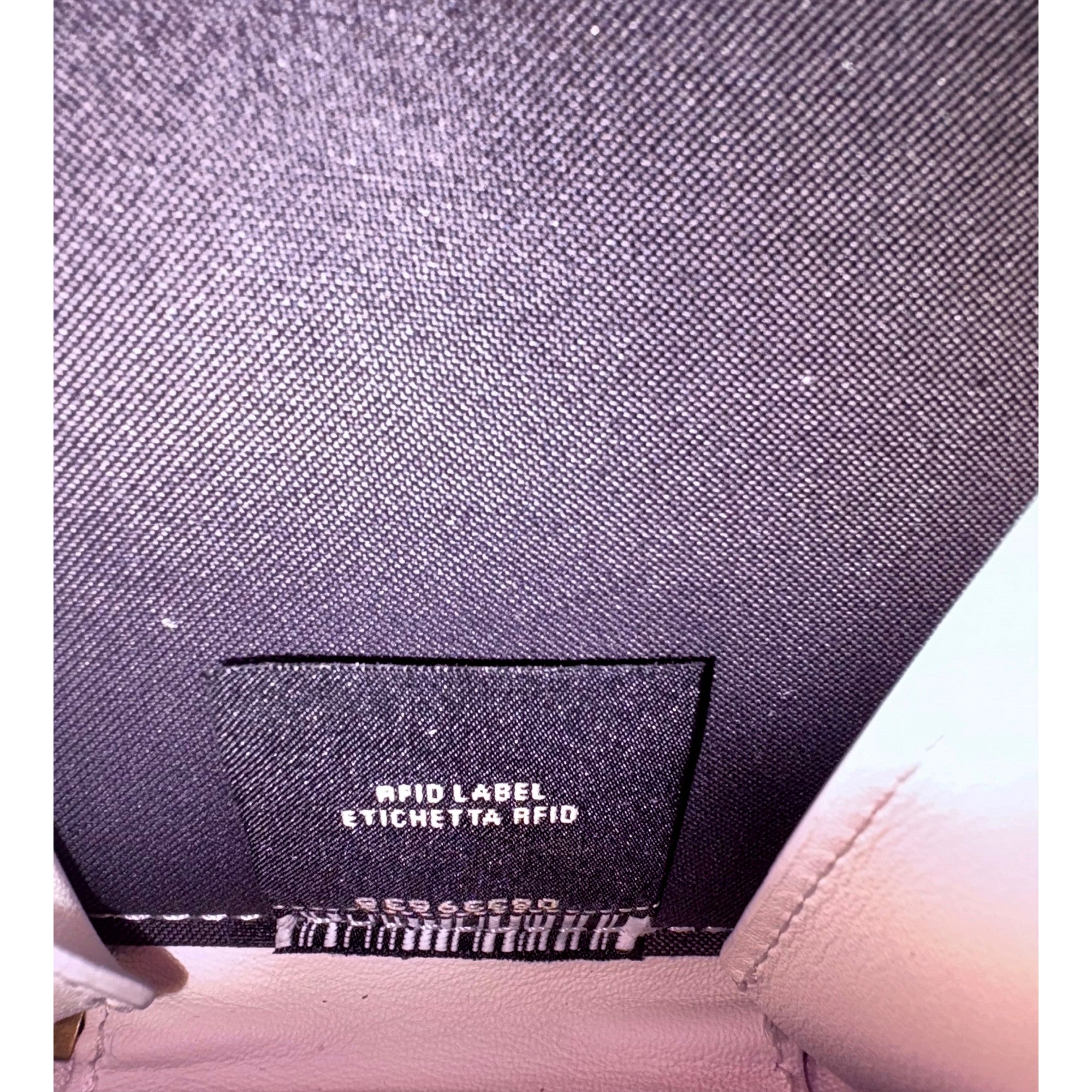 Fendi FF Cube Embossed Small Zip Wallet Bianco White Leather with Strap available at Queen Bee of Beverly Hills