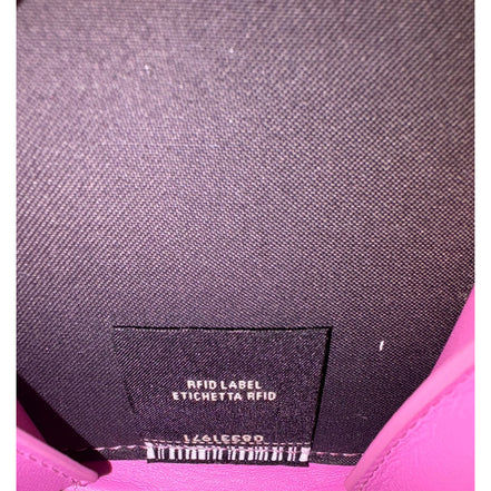 Fendi FF Cube Embossed Small Zip Wallet Pink Leather with Strap available at Queen Bee of Beverly Hills