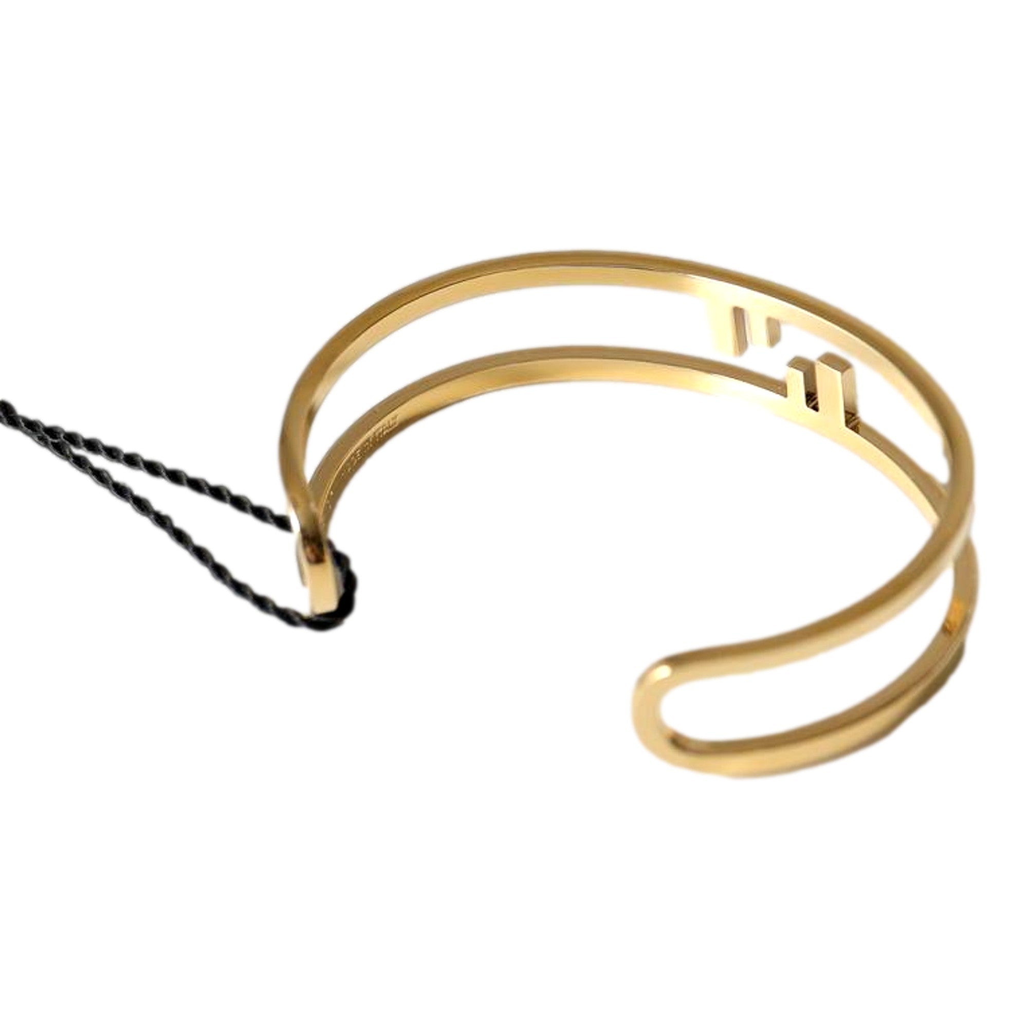 Fendi FF O Lock Gold Tone Metal Cuff Bracelet available at Queen Bee of Beverly Hills