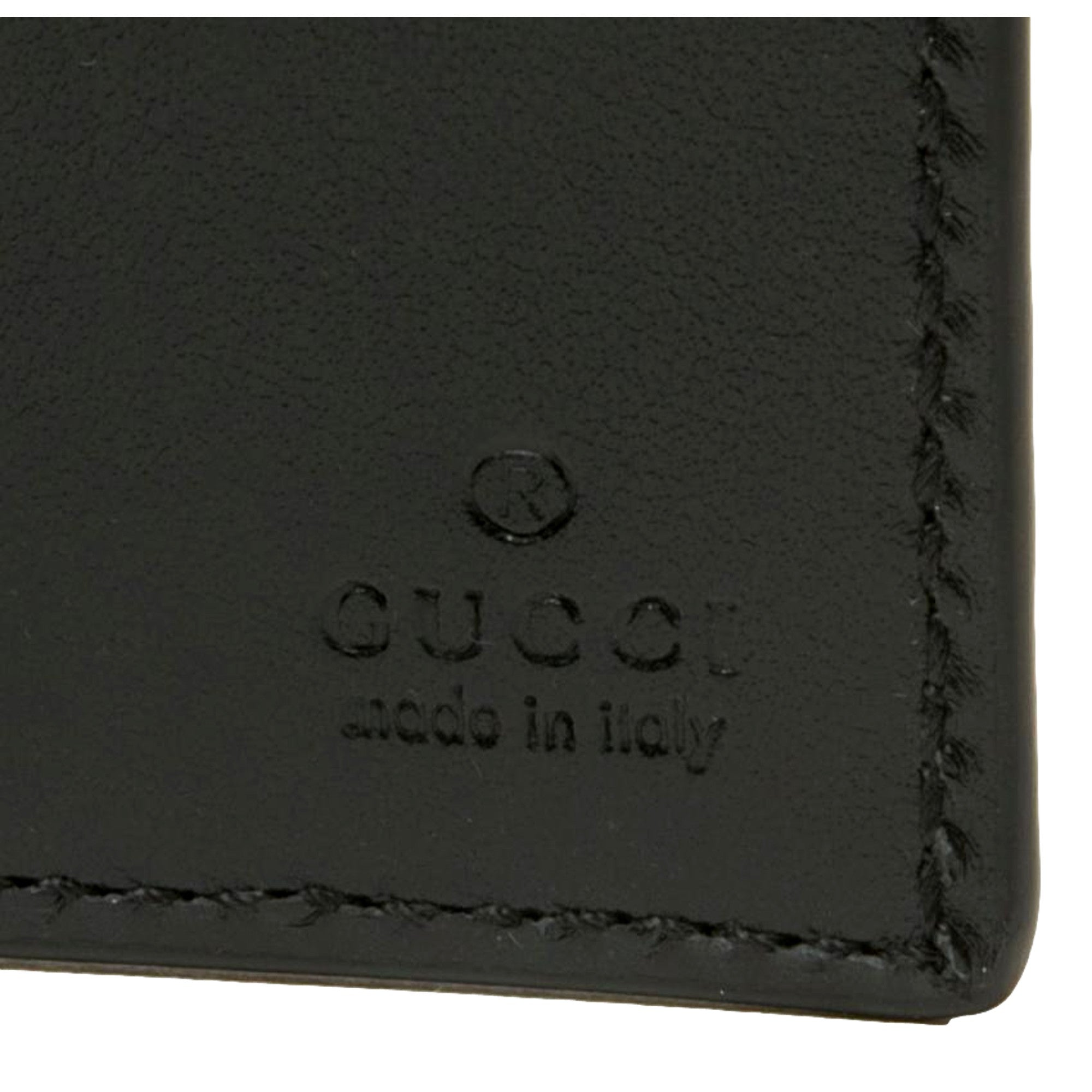 Gucci Calfskin Leather GG Tennis Embossed Bi-Fold Wallet Black available at Queen Bee of Beverly Hills
