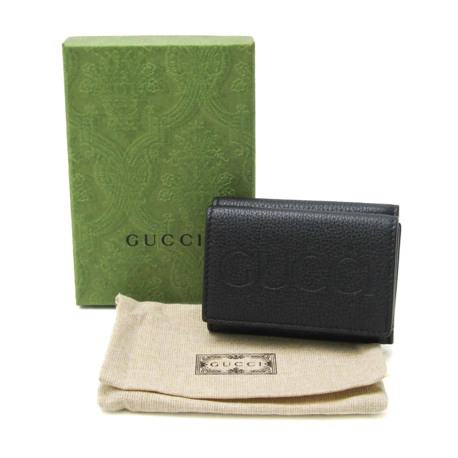 Gucci Embossed Logo Mini Tri-Fold Wallet Black Pebbled Leather available at Queen Bee of Beverly Hills