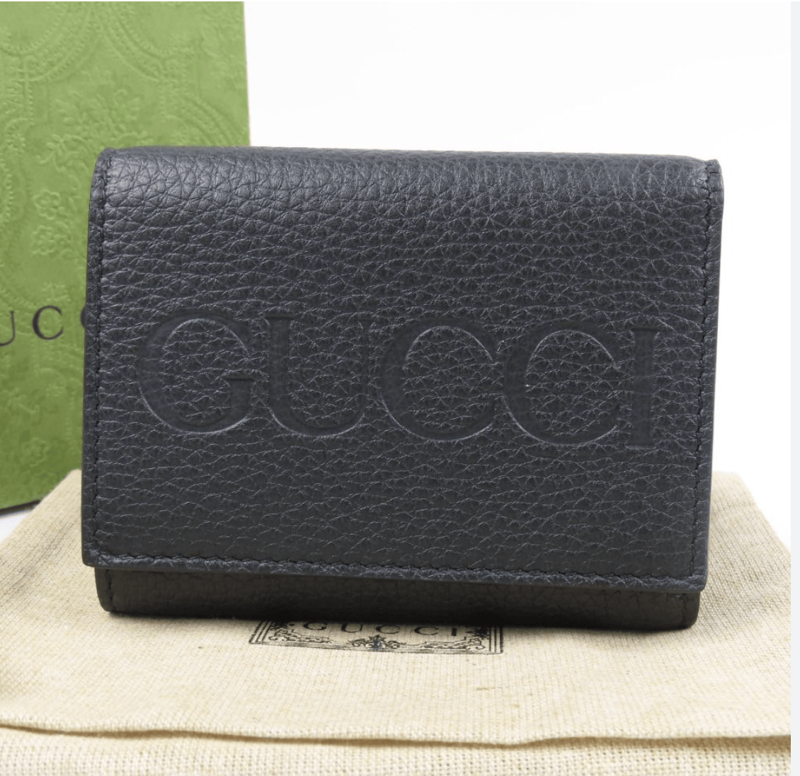 Gucci Embossed Logo Mini Tri-Fold Wallet Black Pebbled Leather available at Queen Bee of Beverly Hills