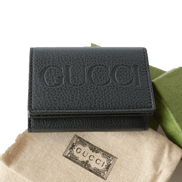 Gucci Embossed Logo Mini Tri-Fold Wallet Black Pebbled Leather available at Queen Bee of Beverly Hills