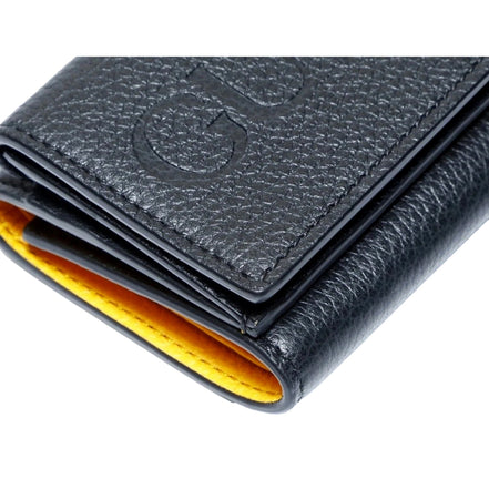 Gucci Embossed Logo Mini Tri-Fold Wallet Black Yellow Pebbled Leather available at Queen Bee of Beverly Hills