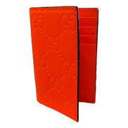 Gucci GG Leather Rubber Effect Neon Orange Folding Wallet Card Holder available at Queen Bee of Beverly Hills