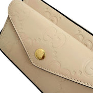 Gucci Gilbert Calfskin Mini Envelope Beige Crossbody Bag available at Queen Bee of Beverly Hills