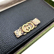 Gucci Interlocking Double G Python Leather Bow Chain Wallet Black available at Queen Bee of Beverly Hills
