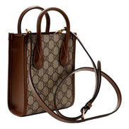 Gucci Interlocking G Leather Emblem Supreme Canvas Brown Leather Mini Shopper Tote sold at Queen Bee of Beverly Hills