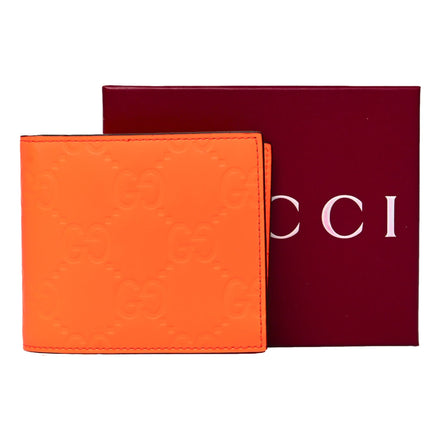 Gucci GG Rubber Effect Neon Orange Guccissima Leather Bifold Wallet sold at Queen Bee of Beverly Hills