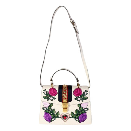 Gucci Sylvie Embroidered Off White Medium Top Handle Bag available at Queen Bee of Beverly Hills