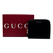 Gucci Black Patent Leather Zip-Around Wallet with Bamboo Pull - available at Queen Bee of Beverly Hills. 