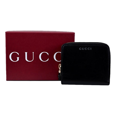 Gucci Black Patent Leather Zip-Around Wallet with Bamboo Pull - available at Queen Bee of Beverly Hills. 