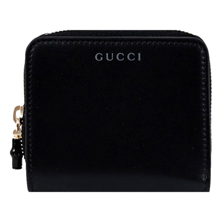 Gucci Black Patent Leather Zip-Around Wallet with Bamboo Pull - available at Queen Bee of Beverly Hills. 