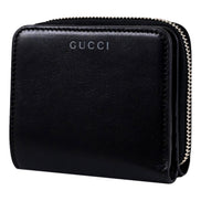 Gucci Black Patent Leather Zip-Around Wallet with Bamboo Pull - available at Queen Bee of Beverly Hills. 