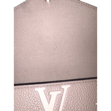 Louis Vuitton Pochette Felicie Monogram Empreinte Leather in Gray - available at Queen Bee of Beverly Hills.