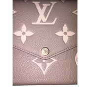 Louis Vuitton Pochette Felicie Monogram Empreinte Leather in Gray - available at Queen Bee of Beverly Hills.