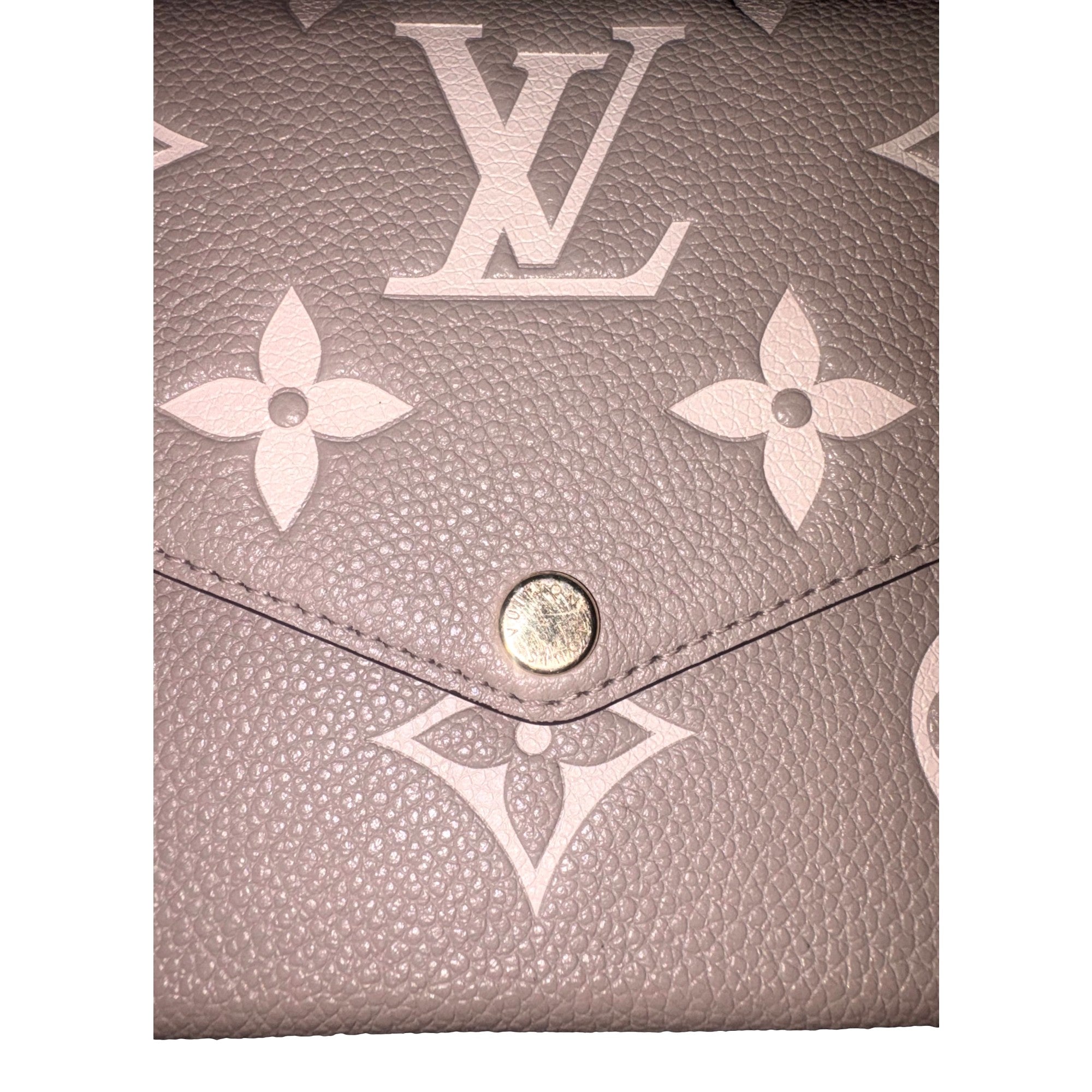 Louis Vuitton Pochette Felicie Monogram Empreinte Leather in Gray - available at Queen Bee of Beverly Hills.