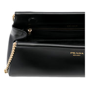 Prada Enchaine Small Shoulder Bag Calfskin Leather Black - available at Queen Bee of Beverly Hills. 
