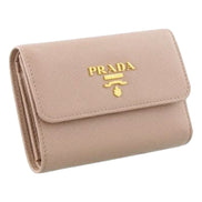 Prada Saffiano Leather Trifold Coin Zipper Card Snap Wallet Cipria Beige available at Queen Bee of Beverly Hills